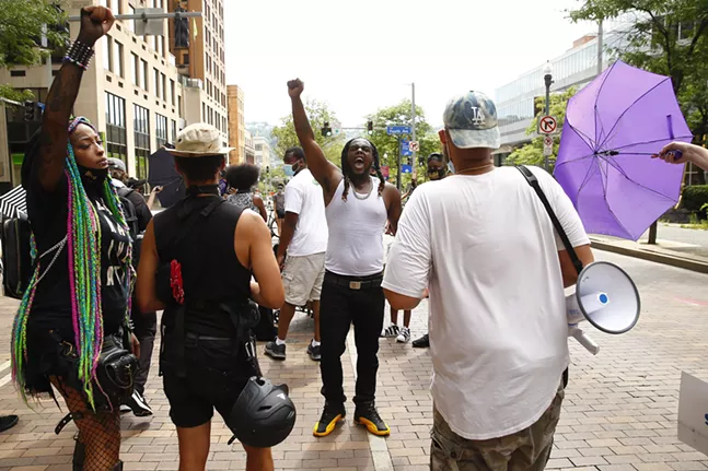Local rapper argues with protest organizers while trying to shoot a music video - CP PHOTO: JARED WICKERHAM