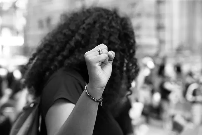 A protester takes part in a Black youth-led Civil Saturdays demonstration in Downtown Pittsburgh on Sat., July 4, 2020 - CP PHOTO: JARED WICKERHAM