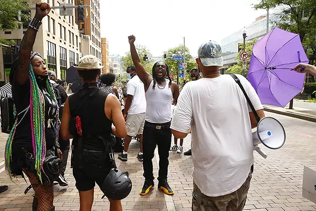 A protest organized by Trans YOUniting marched through Downtown on Fri., July 31. - CP PHOTO: JARED WICKERHAM