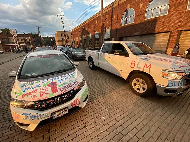 The civil right’s marchers companion vehicles in Wilkinsburg when they marched with Pittsburgh-area Black Lives Matter groups. - CP PHOTO: JARED WICKERHAM