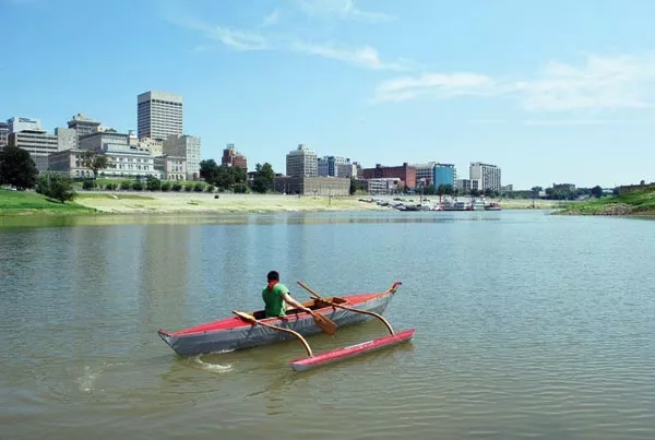 Michael Arcega guides his canoe "Baby: Corps of Re-Discovery" downstream - PHOTO COURTESY OF THE DOLLAR BANK THREE RIVERS ARTS FESTIVAL
