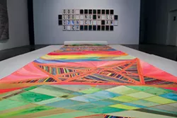 "Illumination + Snack," by Kate McGraw (foreground) and "I’d Like to Solve the Puzzle," by Corey Escoto - PHOTO BY MIKE SCHWARZ