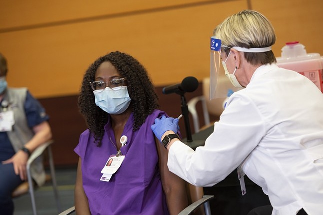 Sylvia Owusu-Ansah, an emergency department physician at UPMC Children’s Hospital of Pittsburgh, receives Pfizer’s COVID-19 vaccine, Mon., Dec. 14 - UPMC