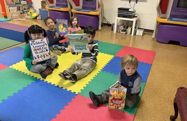 Local children show off their Books for Change books - UNIVERSITY OF PITTSBURGH OFFICE OF CHILD DEVELOPMENT