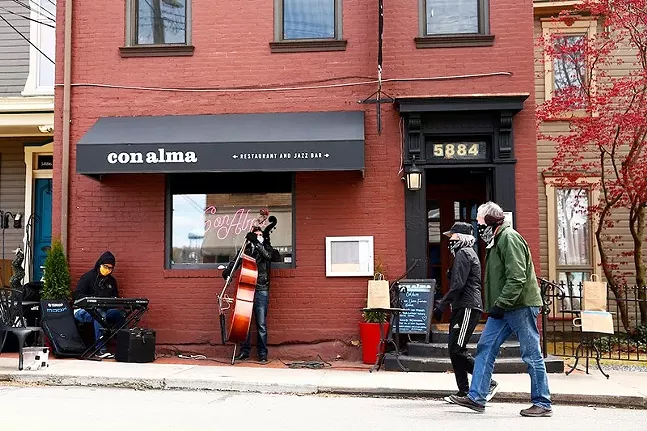 Howie Alexander and Tony DePaolis play in front of Con Alma in Shadyside in May 2020. - CP PHOTO: JARED WICKERHAM