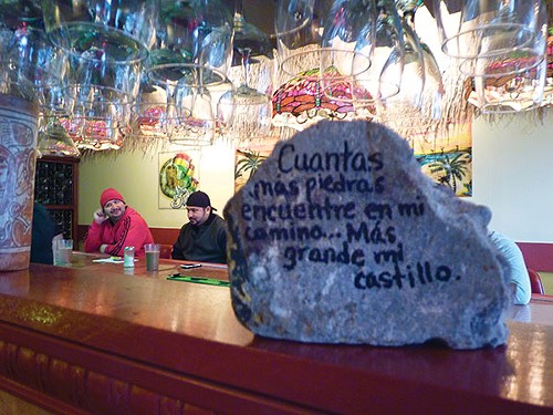 Casa Rasta owners wrote on the rock that was thrown through their window last week. - PHOTO BY ASHLEY MURRAY