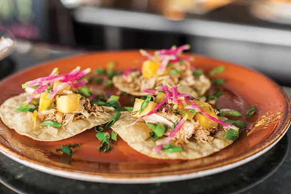 Pineapple chicken tostadas: grilled chicken, pineapple salsa, scallions and radish over corn tortillas - PHOTO BY VANESSA SONG