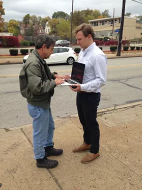 U.S. Senate candidate Joe Sestak answering emails on the go at a Pittsburgh campaign stop in October. - PHOTO BY RYAN DETO