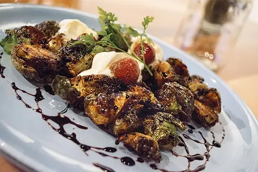 Fried Brussels sprouts with balsamic reduction, whipped goat cheese and roasted grapes - PHOTO BY SARAH WILSON