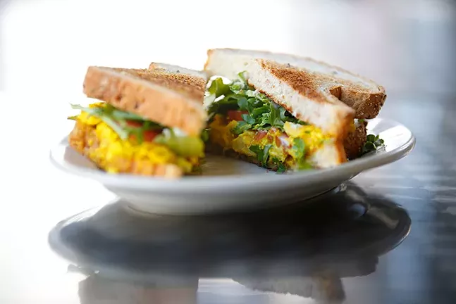A breakfast sandwich made with a tofu scramble, vegan cheese, veganaise, arugula, and tomato on wheat bread from Kaibur Coffee & Cafe - CP PHOTO: JARED WICKERHAM