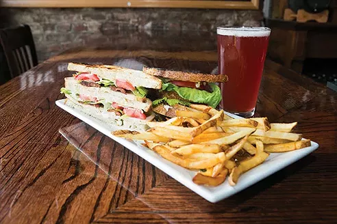 Pints on Penn: Roasted Turkey Club with House Bacon from Pints on Penn: Thick-sliced roasted turkey with lettuce, tomato, mayo and candied bacon - PHOTO BY JOHN COLOMBO