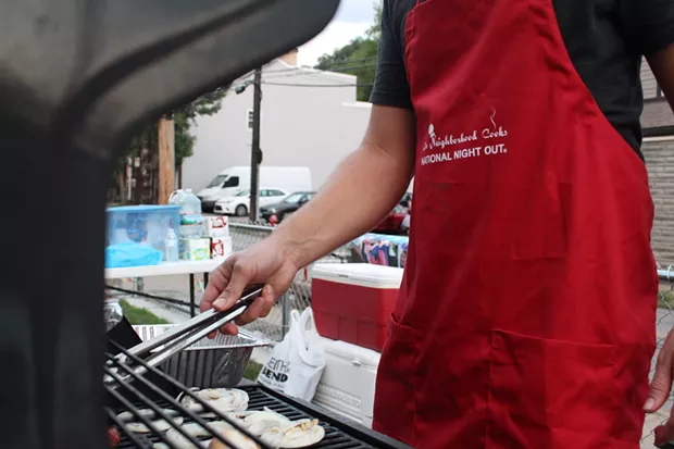 Event organizers yelled to passers by, asking if they'd like something to eat from off the grill. - CP PHOTO BY BILLY LUDT