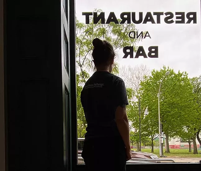 A worker looks out the window of Alphabet City's window on a teaser from City of Asylum's Facebook page - PHOTO: FACEBOOK