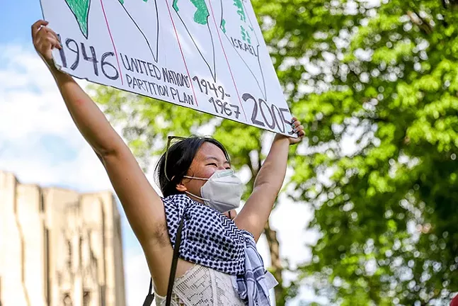 A demonstrator holds up a sign at the Stand in Solidarity with Palestine protest. - CP PHOTO: KAYCEE ORWIG