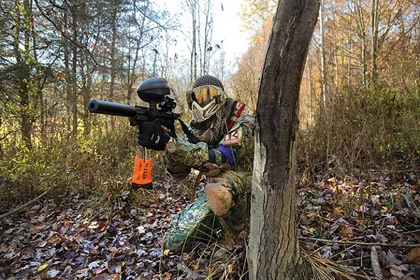 Carl Harrington, a.k.a. Death Card, takes a position during a scenario paintball game at Three Rivers Paintball in Freedom. - CP PHOTO BY THEO SCHWARZ