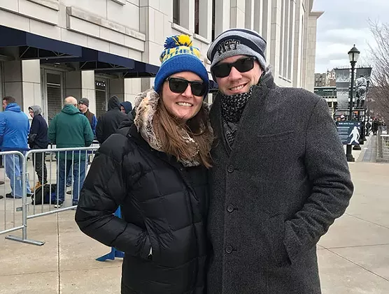 Alex and Caroline Plocki prepare to enter Yankee Stadium for the Pinstripe Bowl. - CP PHOTO BY PAUL GUGGENHEIMER