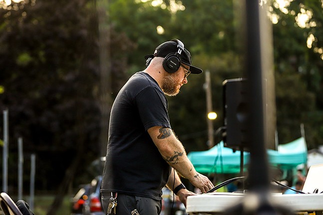 Brad Hlabach DJs in the Dormont Pool parking lot during the Fourth of July Celebration. - CP PHOTO: KAYCEE ORWIG