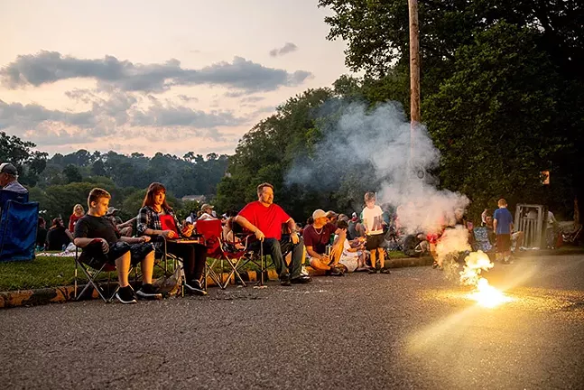 People set off small fireworks before the Dormont Day fireworks during the Fourth of July Celebration. - CP PHOTO: KAYCEE ORWIG