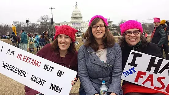 Kara Kernan, Holly Anderton and Marie Rivera-Johnson, all from Pittsburgh, rallied with their signs at the Women's March on Washington. - CP PHOTO BY KIM LYONS