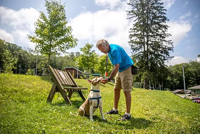 Animal Friends volunteer Jeff Gleeson is walking one of the rescue dogs.  - CP PHOTO: KAYCEE ORWIG