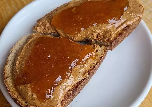B52 Cafe's housemade almond butter toast with organic apricot jam on organic Allegro sourdough - PHOTO: OMAR ABUHEJLEH