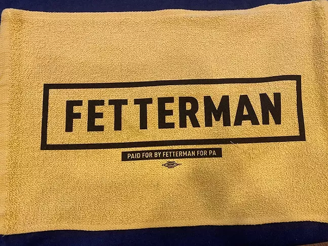 A John Fetterman Terrible Towel, distributed during his Election Night Rally - CP PHOTO: LADIMIR GARCIA