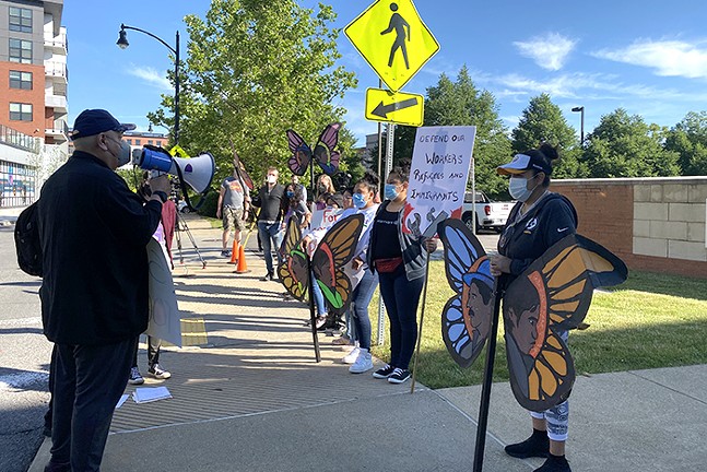 Protesters gather outside ICE headquarters on Fri., June 10, calling for Pittsburgh's immigration court to be reopened. - CP PHOTO: LADIMIR GARCIA