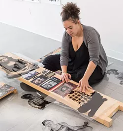 Pittsburgh artist Alisha Wormsley works on her piece for AIR's Active Voice, a project in response to the new administration. - CP PHOTO BY RENEE ROSENSTEEL