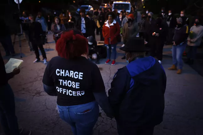 Community members honor Jim Rogers with candlelight vigil on anniversary of his death