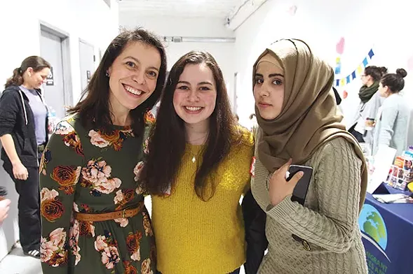 Sloane Davidson (left) with participants in a Valentine’s Day Hello Neighbor event - PHOTO COURTESY OF TAYLOR DAVIDSON