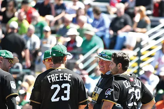 Pittsburgh Pirates manager Clint Hurdle chats with his infield during a pitching change March 17 - CP PHOTO BY CHARLIE DEITCH