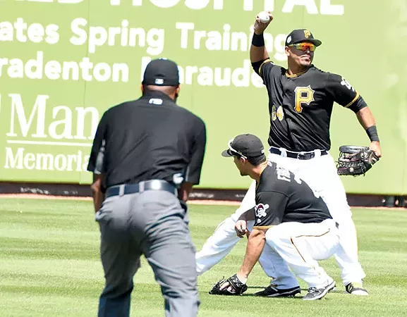 Pittsburgh Pirates outfielder/first baseman Jose Osuna fires the ball to the infield after making a catch during a March 23 preseason game - CP PHOTO BY CHARLIE DEITCH