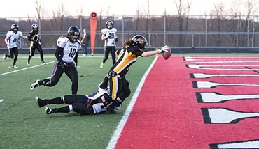 Lisa Horton stretches for the goal line during the Pittsburgh Passion’s April 8 game against Baltimore - CP PHOTO BY LUKE THOR TRAVIS
