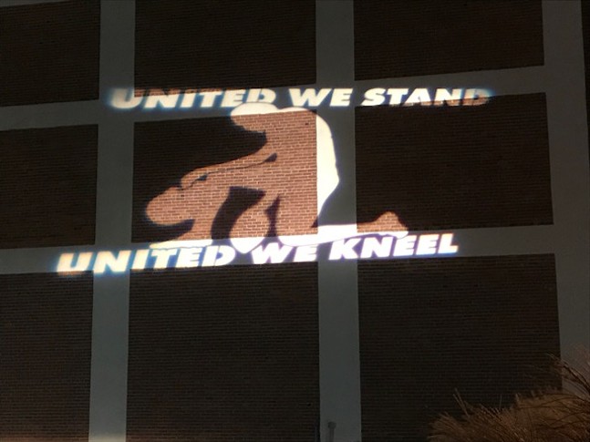Guerilla Artist installs exhibit on Baum Blvd. to highlight NFL protest