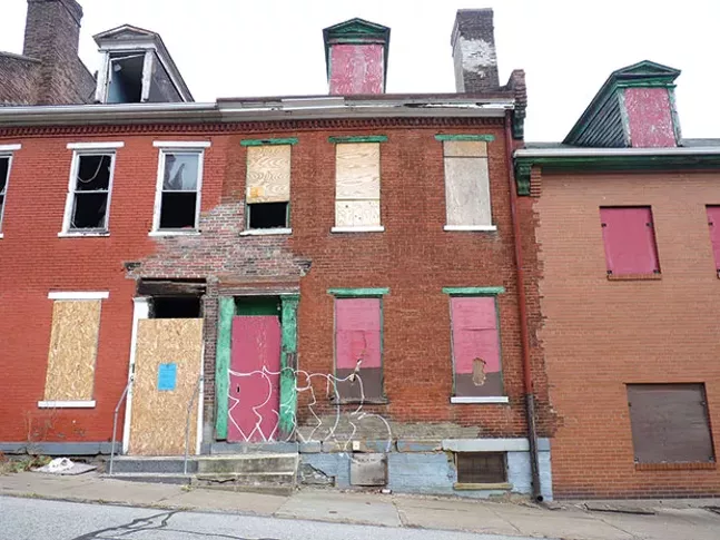 4 Seneca St. in Uptown has been owned by Bob Eckenrode since 2004. The property’s doors and windows are boarded up, and it has sat vacant for years. - CP PHOTO BY RYAN DETO