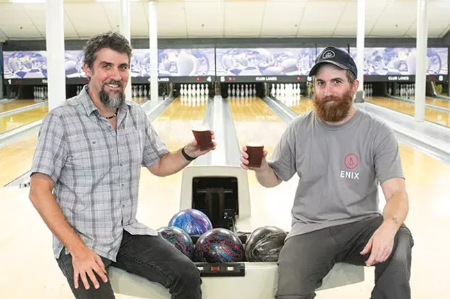 Victor and David Rodriguez inside the bowling alley at Enix Brewing Company - CP PHOTO BY JOHN COLOMBO