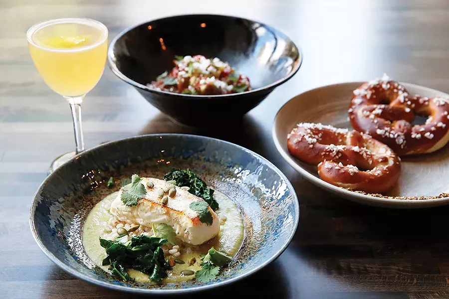 Wild Alaskan halibut, handmade Bavarian-style pretzels, heirloom tomato salad and a Boyd & Bumble cocktail - CP PHOTO: JARED WICKERHAM