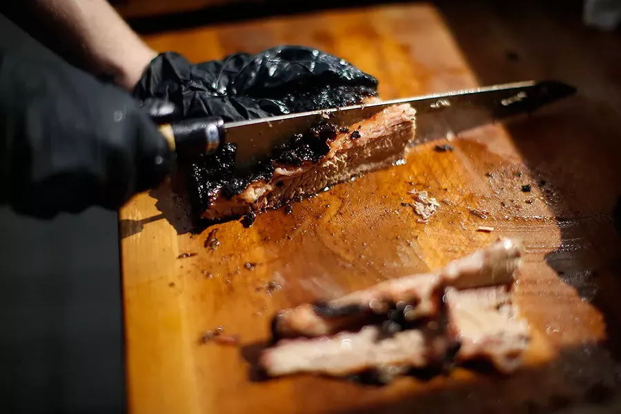 Double deckle brisket is sliced at Spork in Garfield. - CP PHOTO: JARED WICKERHAM