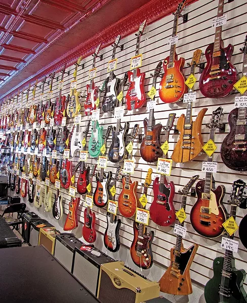 Merchandise for sale inside Pittsburgh Guitars in South Side - BETSY GERSON
