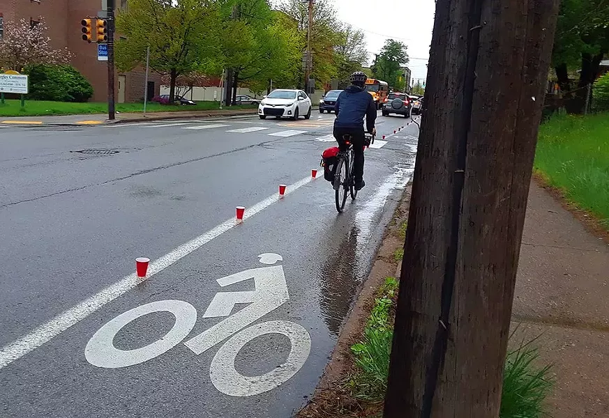 Red cups placed on Negley Avenue bike lane in East Liberty - PHOTO: BIKE PITTSBURGH