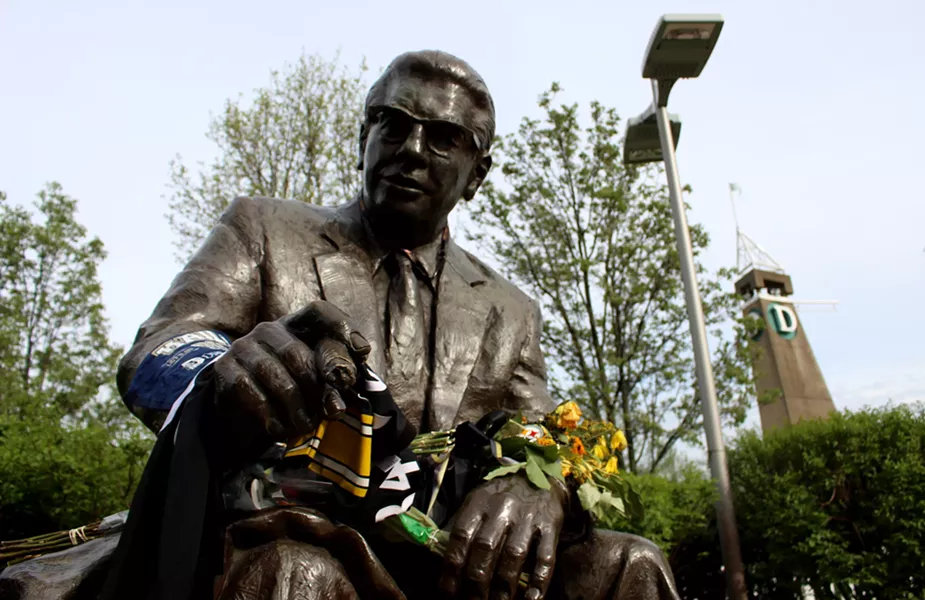 Fans left items at the statue of Art Rooney to honor former Steelers owner Dan Rooney - CP PHOTO BY BILLY LUDT