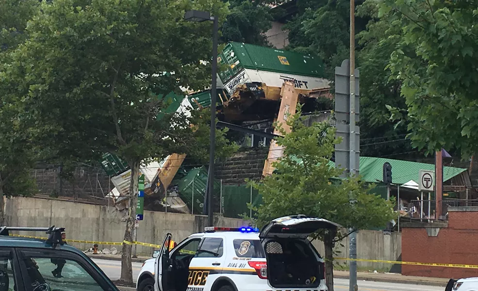 The derailed double-stack freight train in Station Square - CP PHOTO BY ALEX GORDON