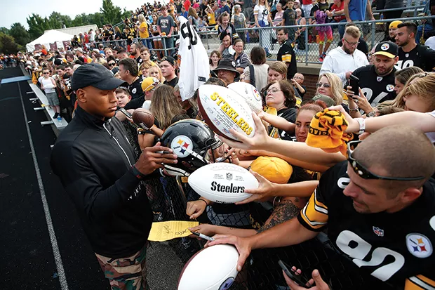 Ryan Shazier signs autographs for fans during training camp. - CP PHOTO: JARED WICKERHAM