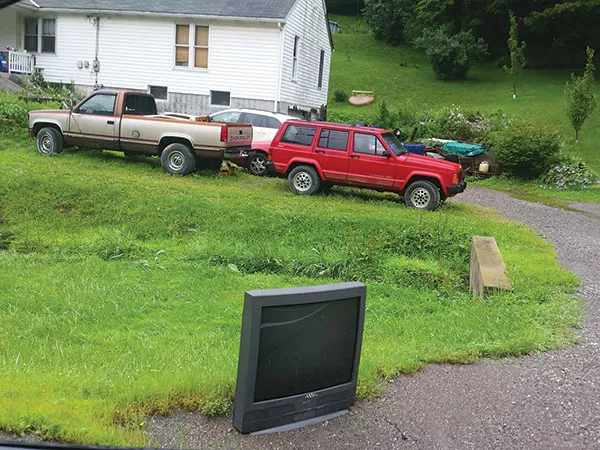 A TV awaits trash pickup that won’t come. - PHOTO BY CHARLIE DEITCH