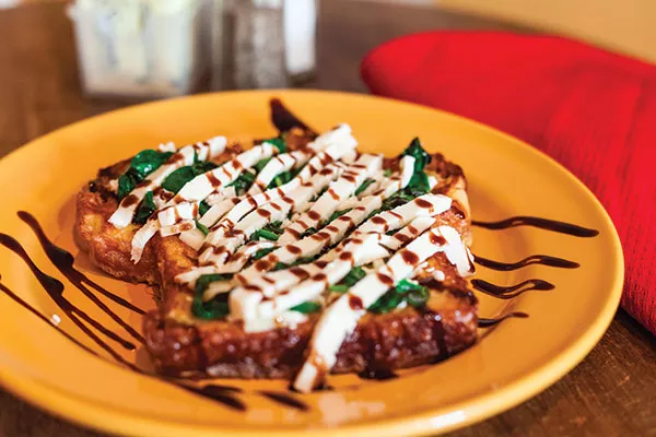 Spanikopita French toast: baby spinach, feta, asiago and fresh mozzarella, drizzled with a balsamic glaze - PHOTO BY VANESSA SONG