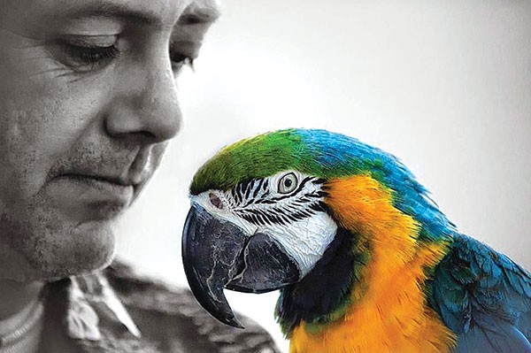 Kenny Sprouse with one of his parrots