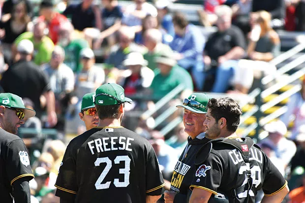 Pittsburgh Pirates manager Clint Hurdle chats with his infield during a pitching change March 17 - CP PHOTO BY CHARLIE DEITCH