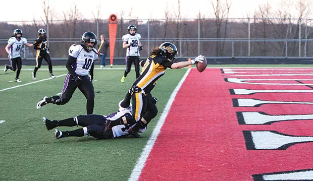 Lisa Horton stretches for the goal line during the Pittsburgh Passion’s April 8 game against Baltimore - CP PHOTO BY LUKE THOR TRAVIS