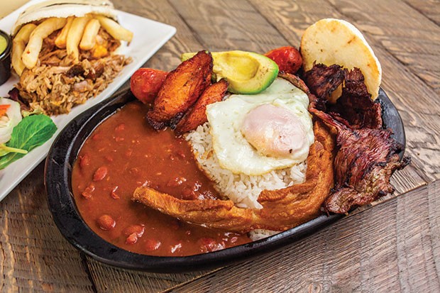 Bandeja Paisa: Steak, Colombian chorizo, fried pork belly, plantains, avocado, egg, red beans, rice and grilled arepa