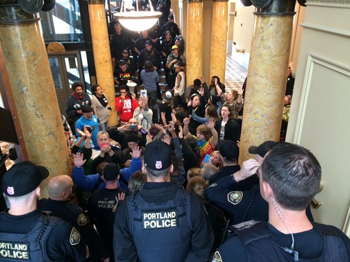 Protestors chant in Portland City Hall, as police block off access to the third floor, where City Council met in a closed-off session.